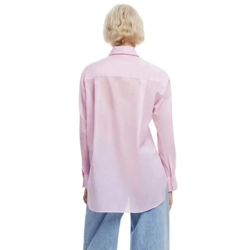Pink long-sleeved floral print button-down shirt displayed in a product image