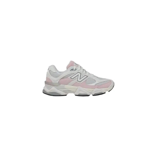 Pink and white New Balance sneaker displayed in the product listing