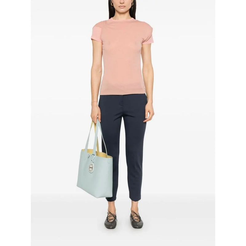 Sac cabas en cuir bleu clair avec intérieur jaune contrastant et fermoir en métal argenté. pinko pantalon slim pour femme