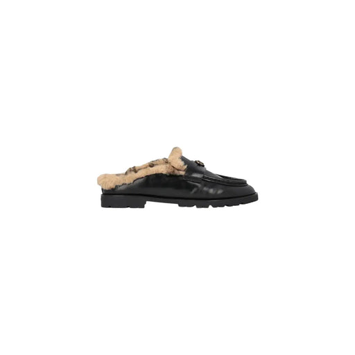 Pinko Mules en cuir noir pour femme, doublées de peau lainée beige et ornées d'un mors métallique.
