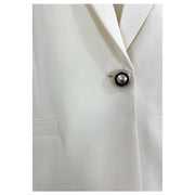 A sleek circular button with a polished silver rim and black pearl disc on pinko women white viscose blazer long v neck