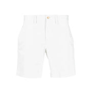 White cotton shorts with button fly and pockets.