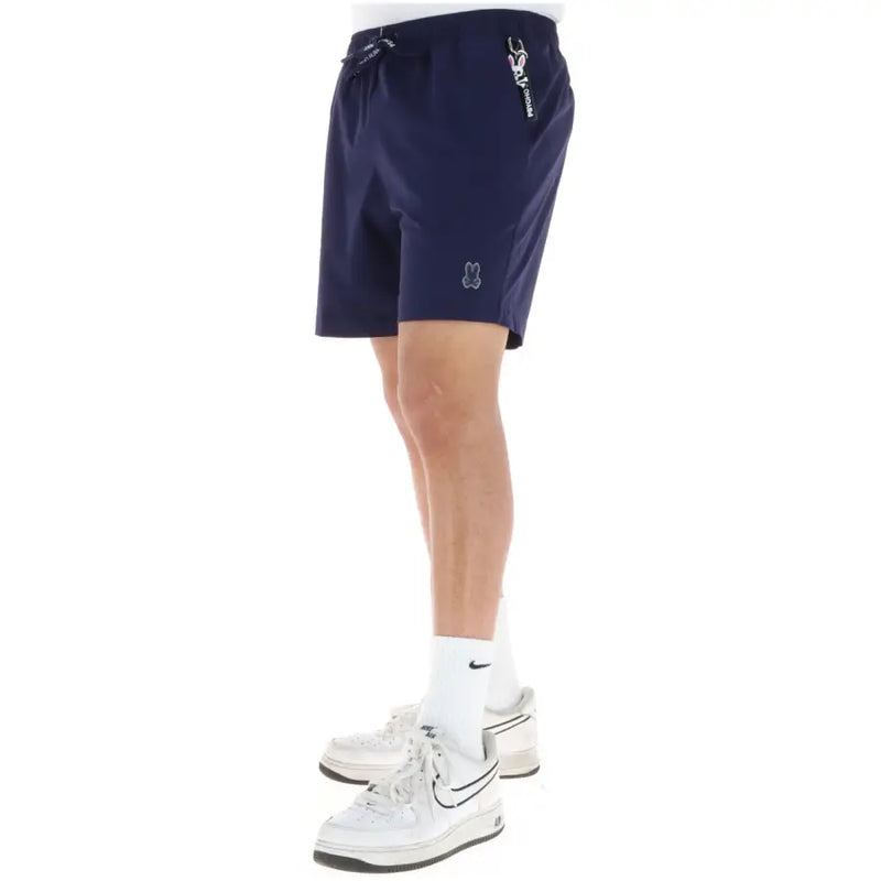 Short de sport Psycho Bunny bleu marine pour homme, en polyester, avec taille élastiquée à cordon et logos brodés sur le côté et la cuisse.