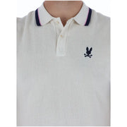 Polo homme en coton crème à motif lapin psychotique, col bordé de rose marine et manches courtes.