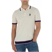 Polo homme Psycho Bunny couleur crème côtelé, avec finitions bleu marine et roses et logo lapin brodé noir en coton