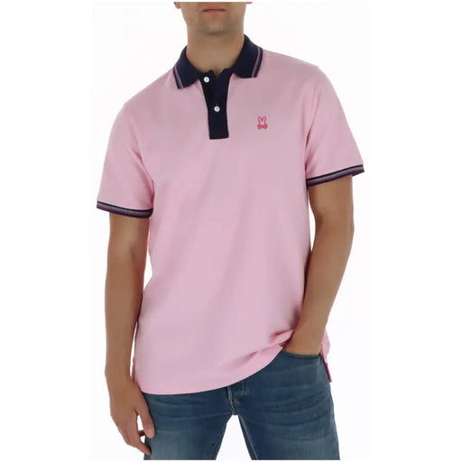 Polo homme Psycho Bunny rose à manches courtes en coton, col bleu marine et logo lapin brodé sur la poitrine