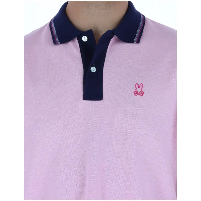 Polo homme Psycho Bunny rose à manches courtes en coton avec col bleu marine et petit logo lapin rose brodé