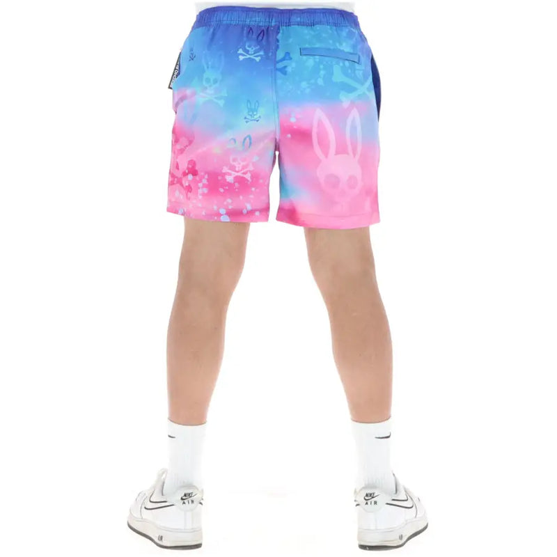 Psycho Bunny men swimwear blue and pink gradient swim trunks with skull and bunny graphics for beachwear