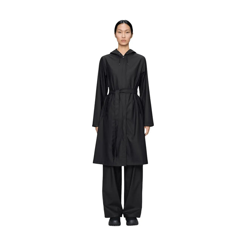 Black hooded trench coat with belted waist and long sleeves made of polyester for women by Rains