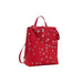 Red faux leather backpack with silver eyelets displayed in a stylish product photograph