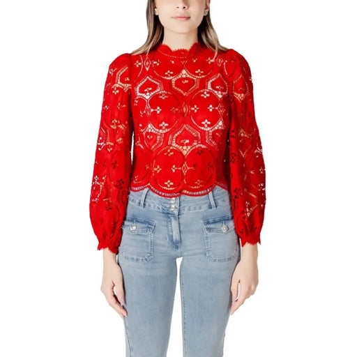 Red lace long-sleeved blouse displayed on a model, elegant and fashionable attire