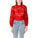 Red lace long-sleeved blouse displayed on a model, elegant and fashionable attire