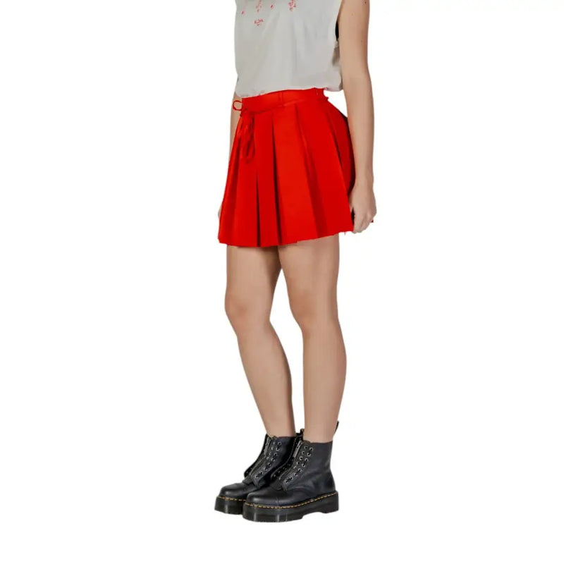 A vibrant red lace polyester skirt for women featuring a pleated mini design with a matching drawstring waistband