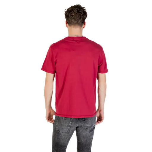 Red T-shirt with Norwegian Flag graphic paired with gray jeans displayed for sale