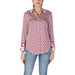 Red and white patterned blouse with light blue jeans, featuring Guess Women’s design