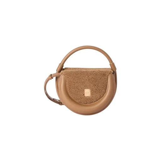 Brown half-moon shaped women’s handbag with fuzzy front flap and top handle for Fall Winter