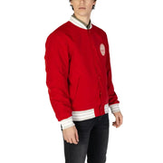 Blazer rouge style universitaire pour homme Replay, avec bordures blanches au col, aux poignets et à la taille, et poches zippées classiques sur le devant.
