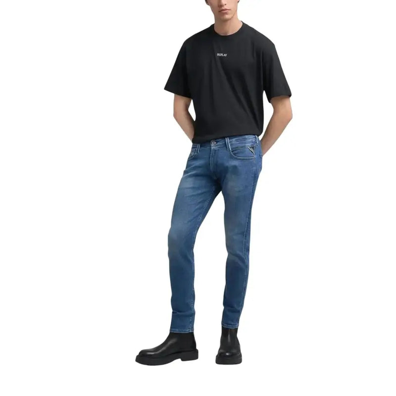Blue denim jeans with a slim fit and dark wash color.