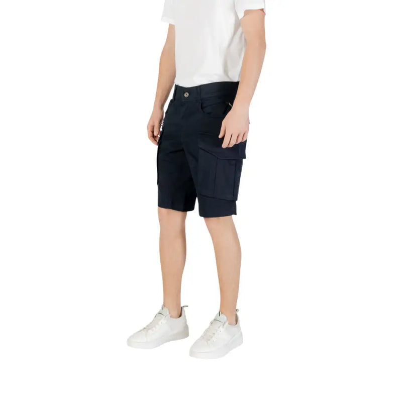 Black cargo shorts with white sneakers and a plain t-shirt.
