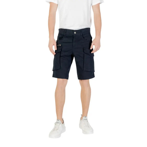 Black cargo shorts with multiple pockets and white sneakers