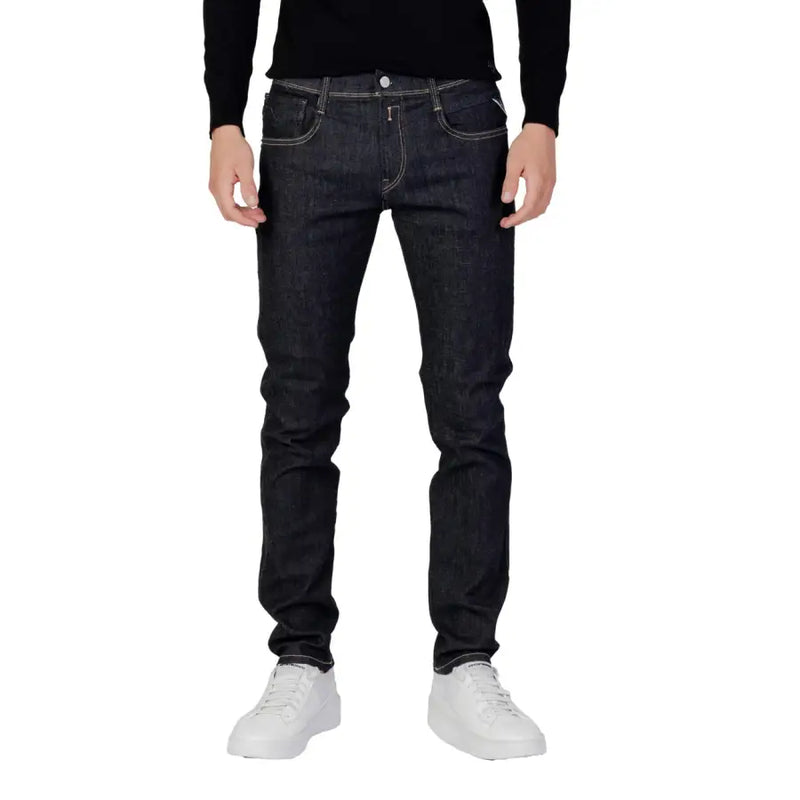 Jean slim bleu indigo foncé pour homme, coupe Replay, avec surpiqûres blanches et fermeture éclair et bouton.