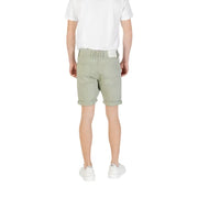 Light green chino shorts with rolled hem and elastic waistband, suitable for casual wear.