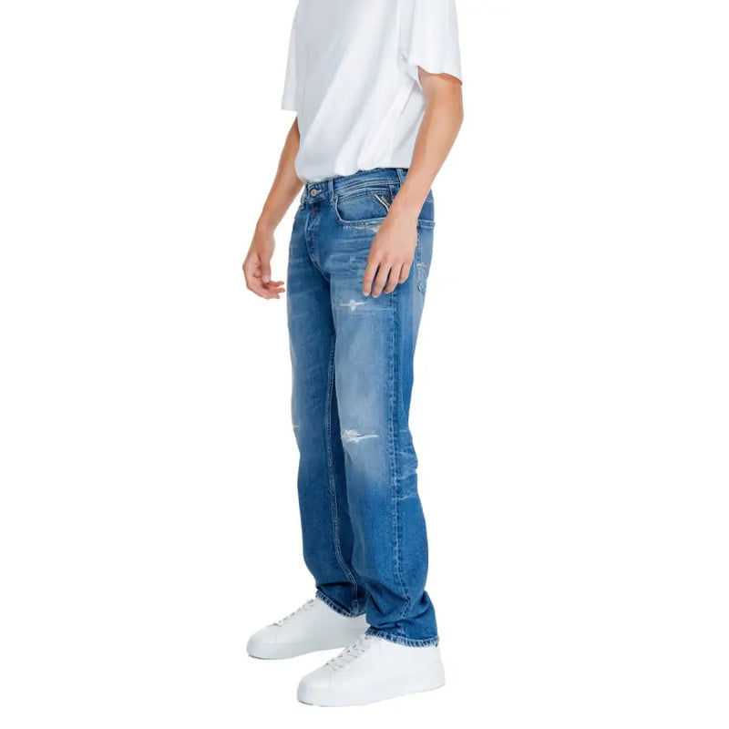 Jean homme Replay bleu uni à fermeture éclair et boutons, taille 32 (réf. MA972P.000), en denim avec empiècements usés et coupe classique cinq poches.