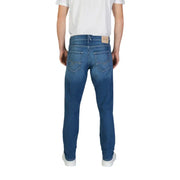 Replay men jeans in blue denim with classic straight-leg cut, subtle fading, and reel flex label on back waistband