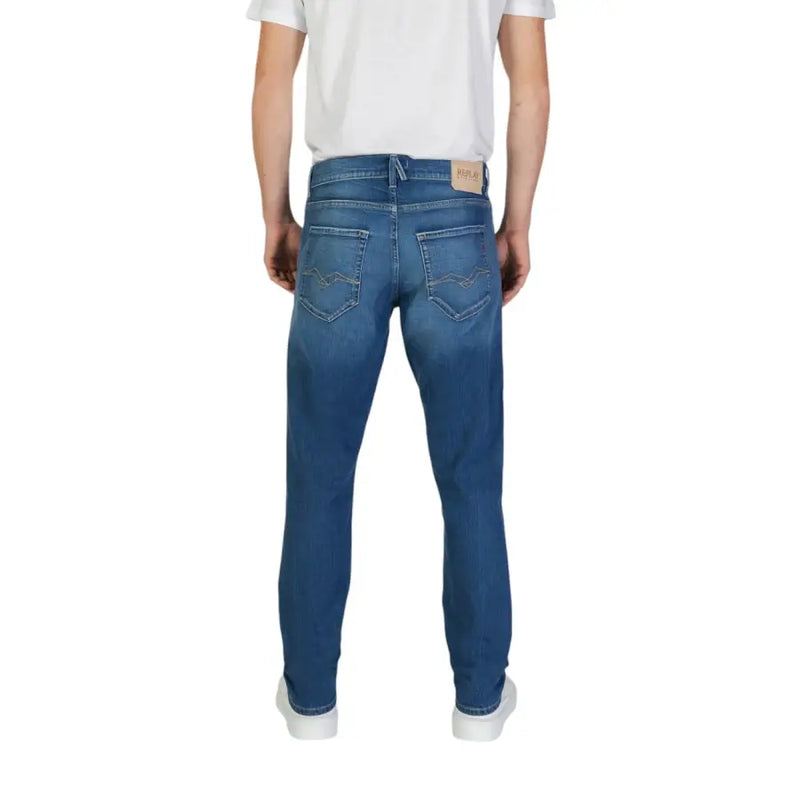 Replay men jeans in blue denim with classic straight-leg cut, subtle fading, and reel flex label on back waistband