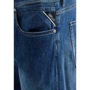 Back side of replay men straight leg jeans in dark blue stretch cotton denim with subtle faded wash and branded back pocket patch