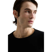 T-shirt à manches longues en coton noir pour homme Replay, col rond, arborant un design classique et décontracté de couleur noire.