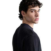 Pull Replay pour homme, noir, en maille côtelée et col rond, confectionné en coton pour un style décontracté et confortable.