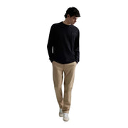 Pull Replay pour homme, en coton gaufré noir à manches longues et col rond, avec logo brodé discret sur la poitrine gauche.