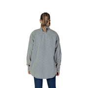 A woman wearing a replay women pinstripe long-sleeved button-up shirt in blue and gray for spring summer