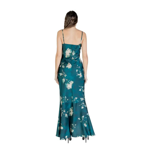 Woman wearing Rinascimento Green Floral Strap Dress with Zip and Round Neck