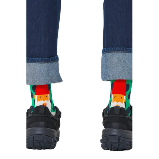 Rolled-up jeans with Santa socks and black sneakers featuring Green Gnome Polka Dot Socks