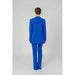 Royal blue women’s blazer with buttoned front pockets in stylish pantsuit design