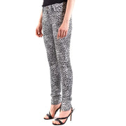 Saint Laurent white leopard print women jeans featuring black and white skinny denim with a bold animal pattern