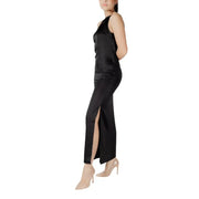 Sleeveless black satin maxi dress with halter neck and high slit in a sleek, form-fitting design