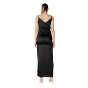 Back view of sleeveless black satin maxi dress with crossed-back design in elegant slip style