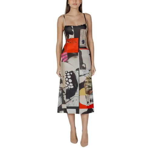Sleeveless midi dress with abstract patchwork print showcasing stylish fashion design