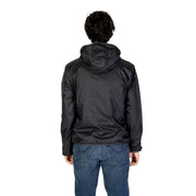 Men’s black hooded windbreaker jacket paired with blue jeans displayed with sophisticated tailored blazer in premium fabric