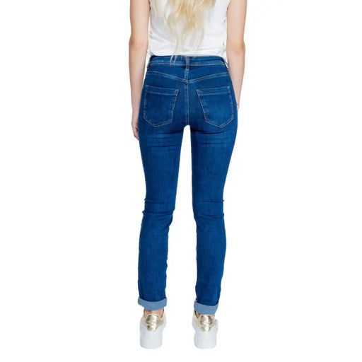 Woman wearing Street One Blue Plain Jeans with cuffed ankles and a white top