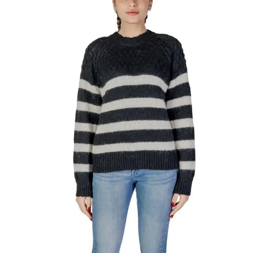 Black Striped Women’s Knit Sweater featuring a Round Neck design for casual elegance