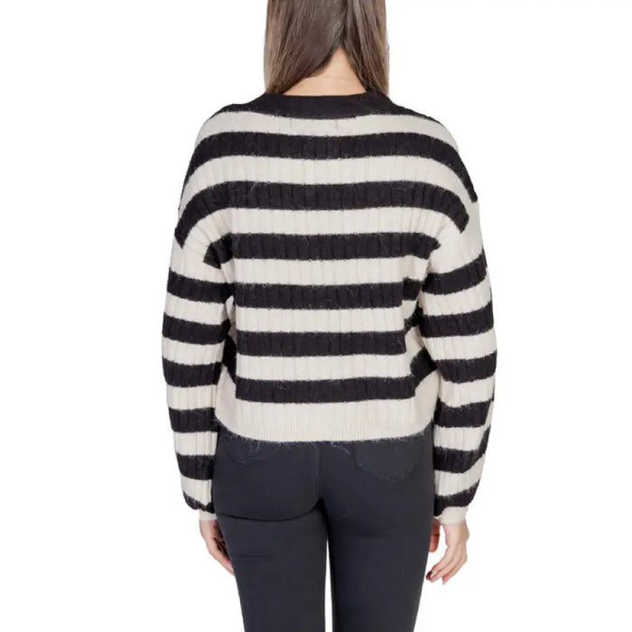 Striped knit sweater displayed on a model in the Striped Knit Cardigan collection