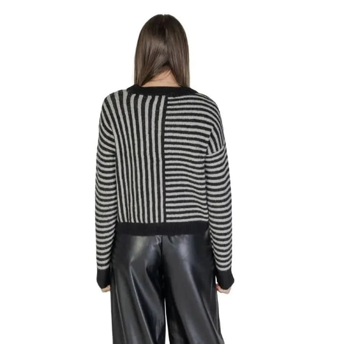 Vero Moda Black Striped Long Sweater paired with stylish leather pants