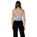 Striped strapless tube top paired with black pants for a stylish, modern look