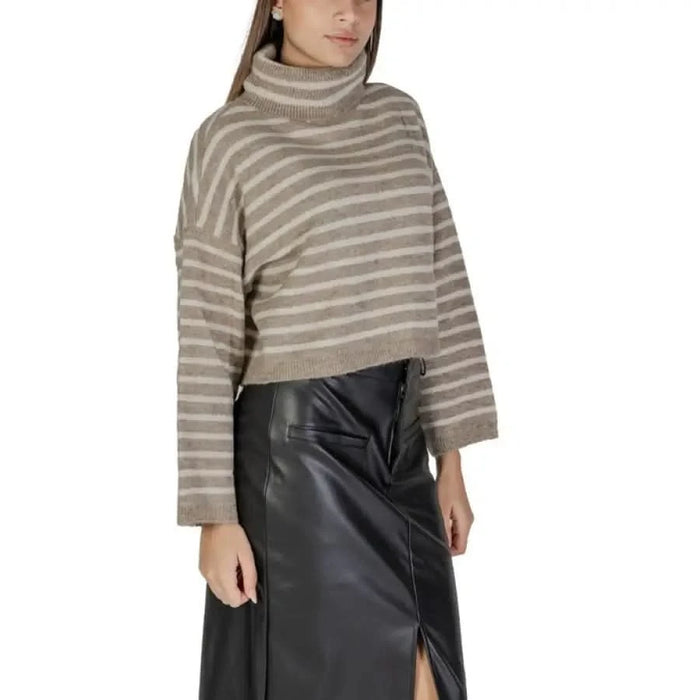 Beige striped turtleneck sweater for women, perfect for fall and winter styling