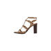 Brown studded heeled sandal featuring leather straps and a stylish heel design