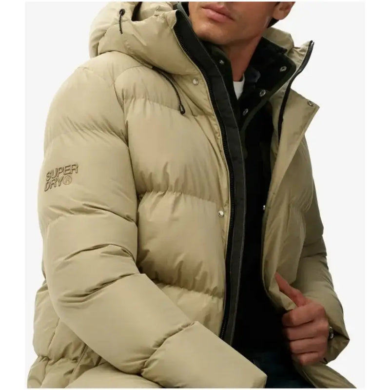 Beige puffer jacket with hood and gold zipper, superdry brand.